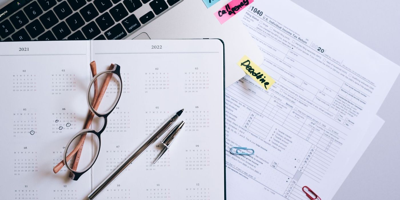 A planner and calendar marking a renewal deadline