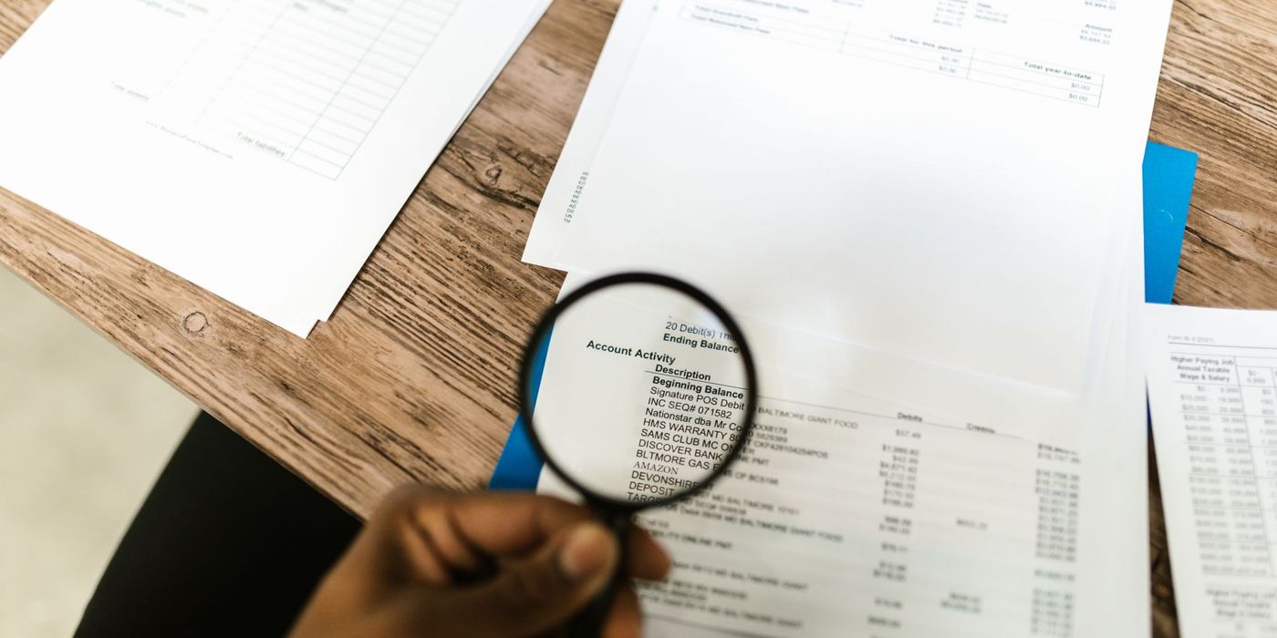 Inspecting a document closely with a magnifying glass