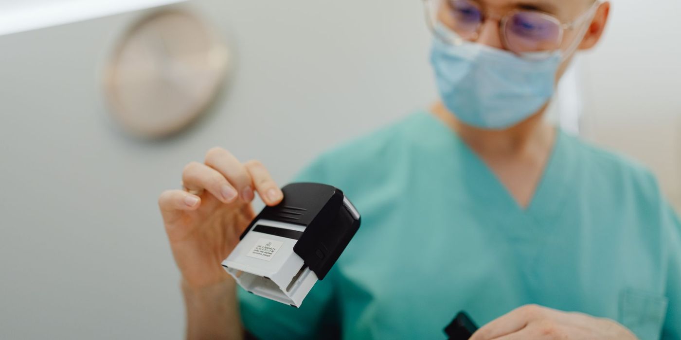A quality officer applying an approval stamp