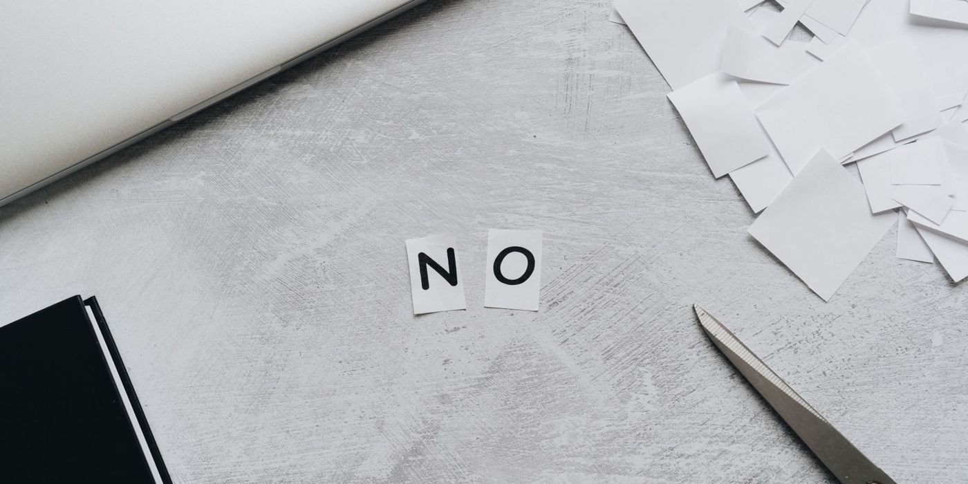 Cut-out paper letters spelling the word no